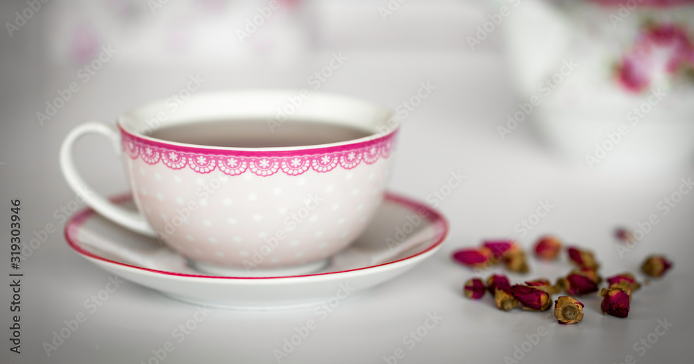 A cup of tea with dried roses