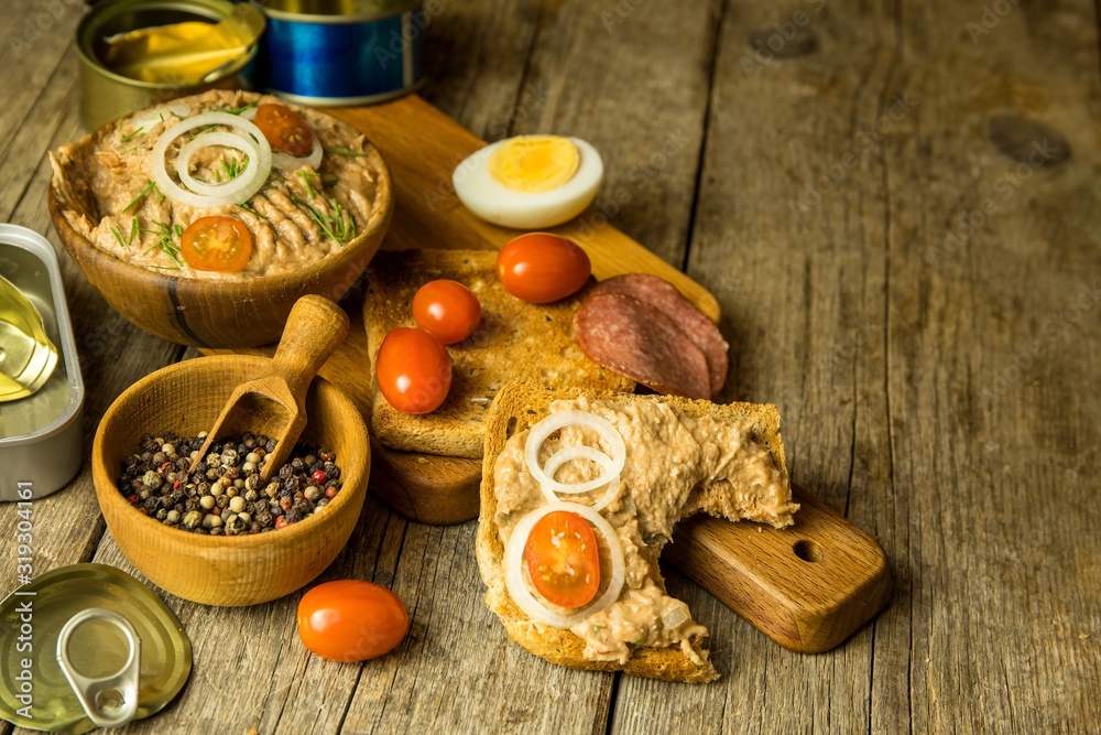 Fototapeta premium Sardine spread with toast. Healthy food from fish. Canned fish. Homemade healthy food.