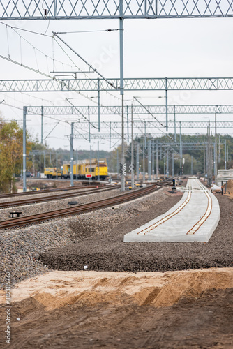 Modernization of the railway line. New track, crushed stone, railway sleepers, poles, trusses and energy infrastructure.