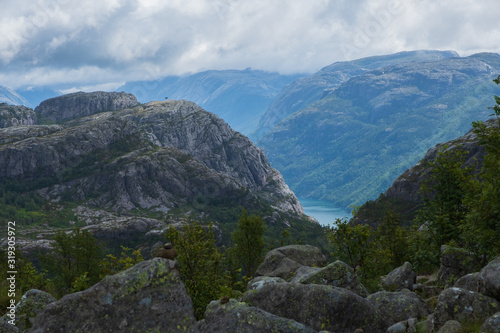 Preikestolen massive cliff Norway, Lysefjorden summer morning view . Beautiful natural vacation hiking walking travel to nature destinations concept. July 2019