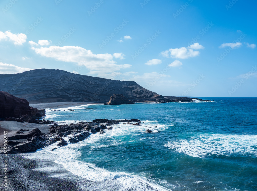 The surf on volcanic black beach El Golfo, island Lanzarote