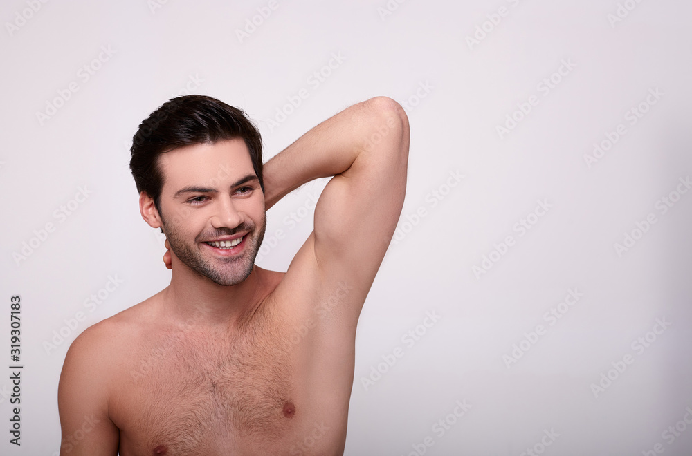 Cool dark haired guy smiling and looking sideway Cool dark haired guy smiling and looking sideway