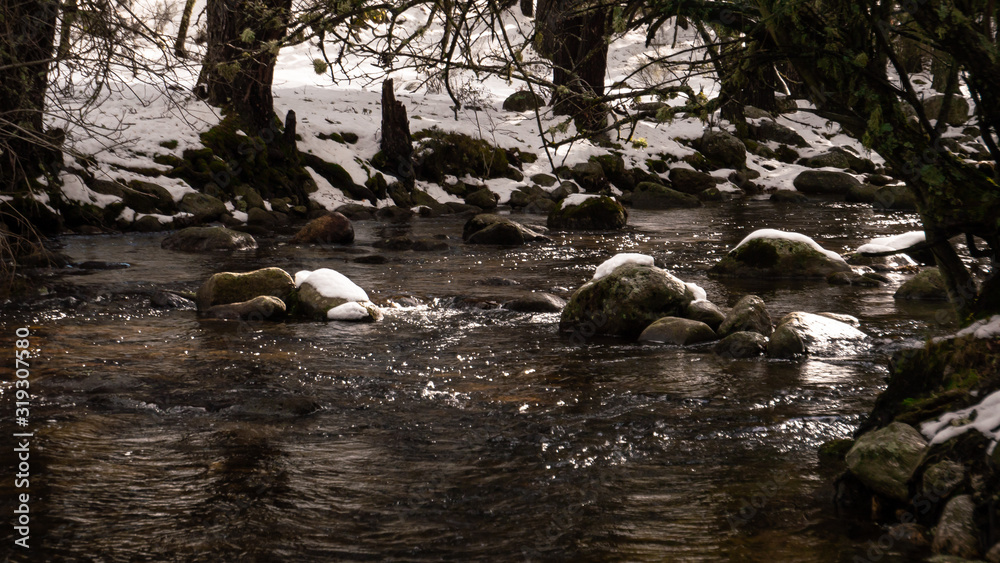 Fototapeta premium Beautiful snowy landscape of Guadarrama mountains in a small medieval town of Rascafria near the Spanish capital Madrid in winter. Famous touristic attraction for winter sports, leisure in Spain