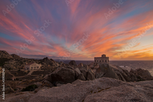 Sunset at the Capotesta lighthouse in Sardinia photo
