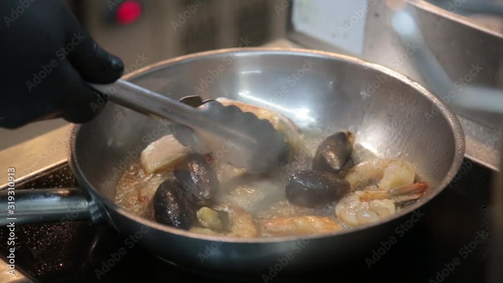 Close up shot of frying shrimps, prawns, mussels and fish in boiling oil. HD Close up shot of frying shrimps, prawns, mussels and fish in boiling oil. HD
