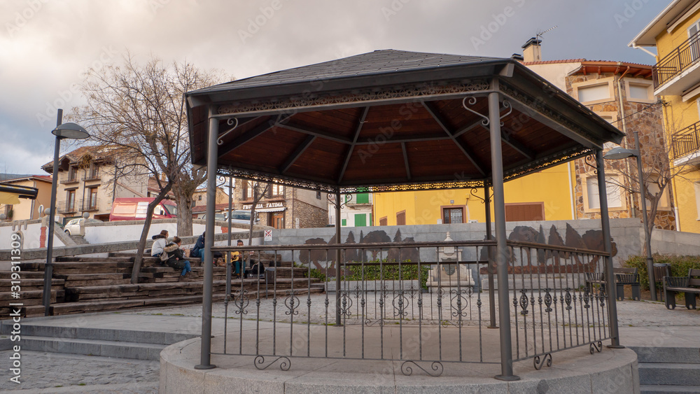 Beautiful snowy landscape of Guadarrama mountains in a small medieval town of Rascafria near the Spanish capital Madrid in winter. Famous touristic attraction for winter sports, leisure in Spain