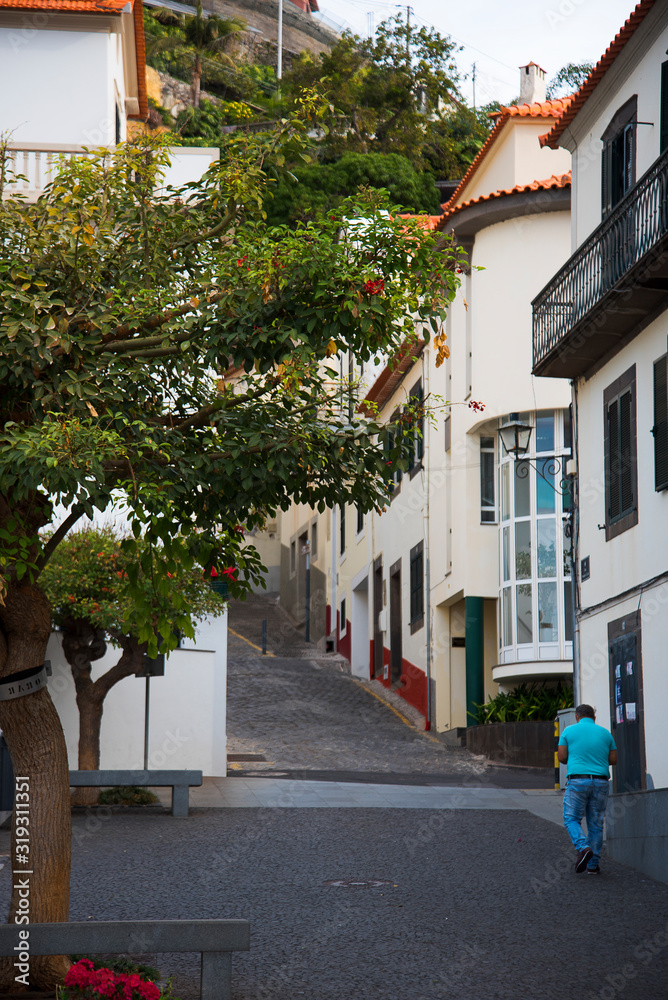 Steep street in Funchal the capital city of Madeira an island in the Atlantic Ocean
