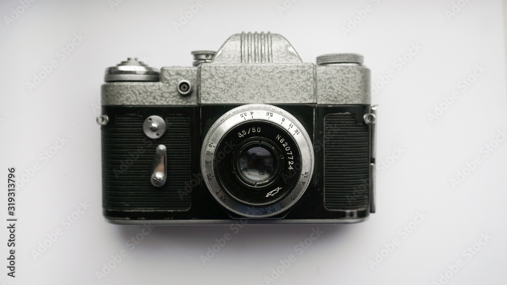  The old Soviet 35mm SLR camera. Retro photo technology on the white background