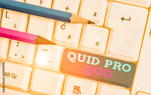 Conceptual hand writing showing Quid Pro Quo. Concept meaning A favor or advantage granted or expected in return of something White pc keyboard with note paper above the white background photo