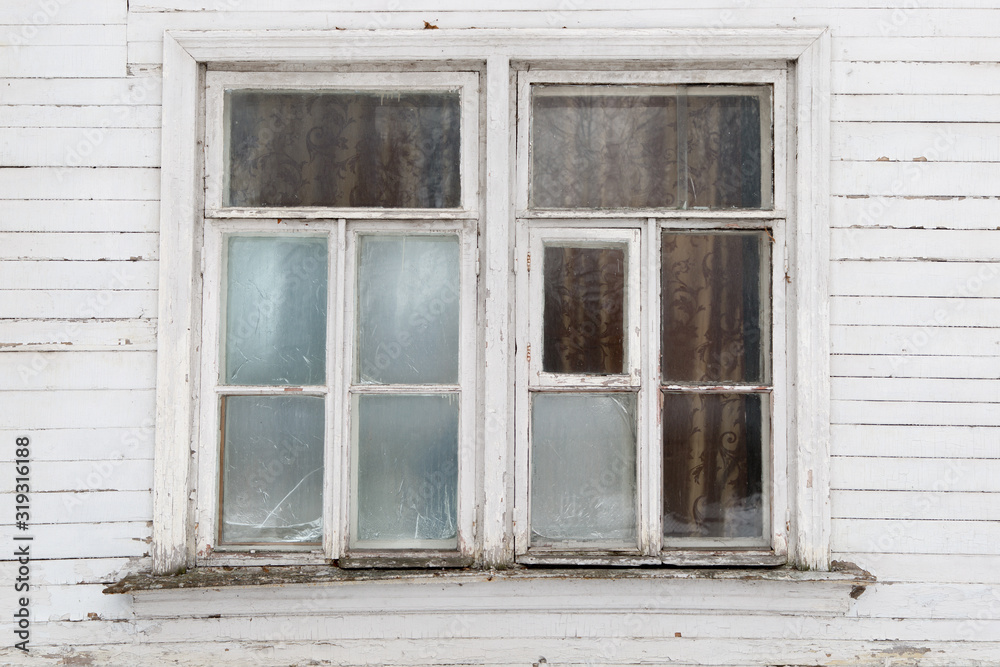 Old window in a wooden building
