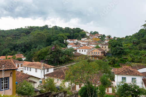 Colonial style houses in the mountain with "Agua Limpia" neightborhood in the background. Ouro Preto city, Minas Gerais - Brazil.