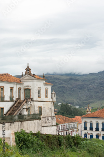 OURO PRETO, MINAS GERAIS, BRAZIL - DECEMBER 23, 2019: Vertical landscape of astronomical observatory "Escola de Minas" with mountain in the background in Ouro Preto, Minas Gerais, Brazil