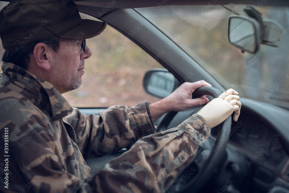 army veteran with artificial limb driving a vehicle