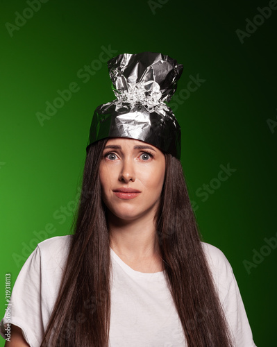 Good looking woman wearing tin foil hat photo