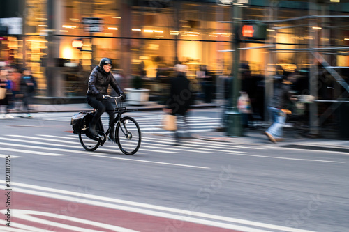 Bike Rider in New York City, going fast © Mark