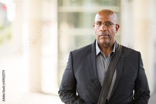 Portrait of a mature African American businessman on his way to work.