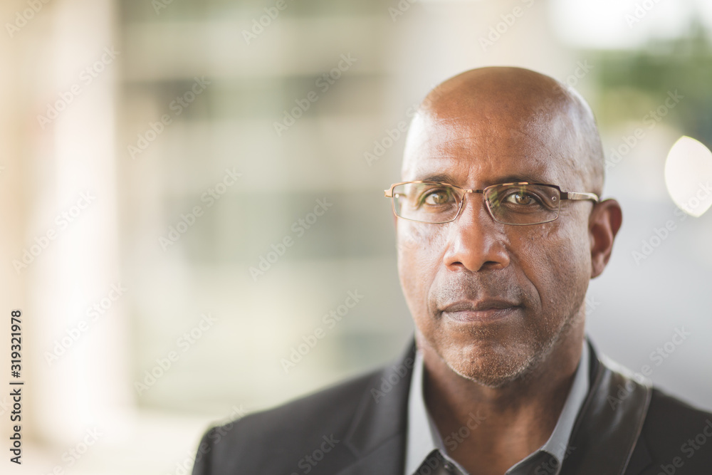 Portrait of a mature African American businessman on his way to work.
