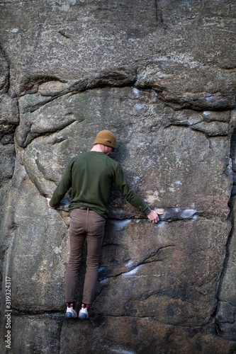 Shifting hands while rock climbing © Mark