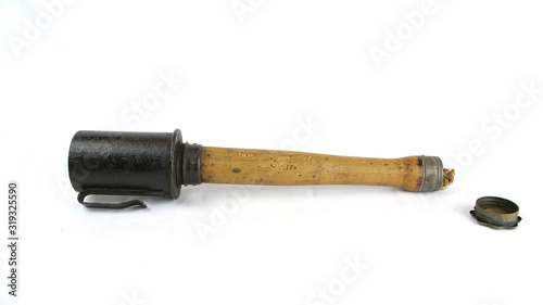 WW1 German Stick Grenade Model 1916. These grenades were use in large quantities by the German Army during the Great War. It includes a belt clip. Grenades were particularly useful in trench warfare.  photo