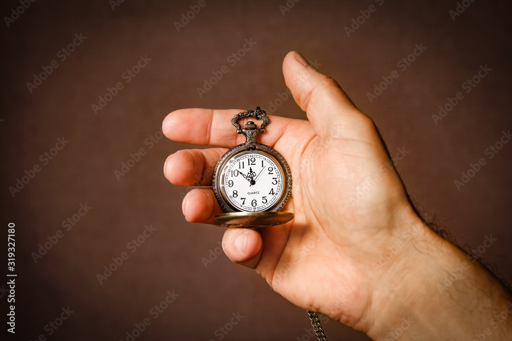 a pocket watch in the hands of a man a pocket watch in the hands of a man