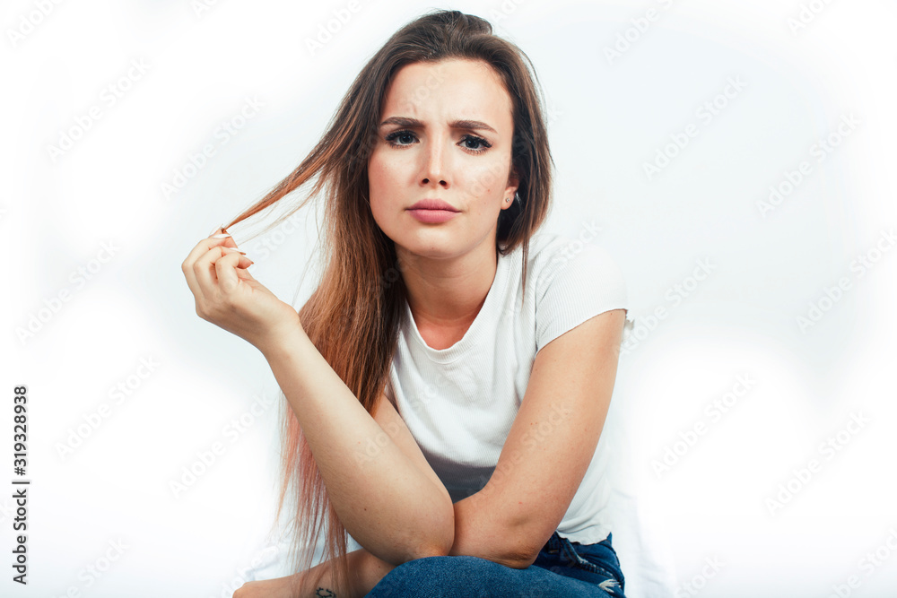 young pretty teenage hipster girl posing emotional happy smiling on white background, lifestyle people concept