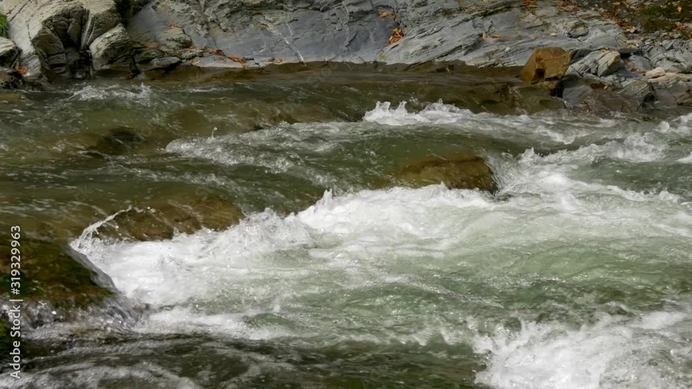 Close-up Mountain River Cascade Waterfall. Water Stream Rocks Close-up Mountain River Cascade Waterfall. Water Stream Rocks