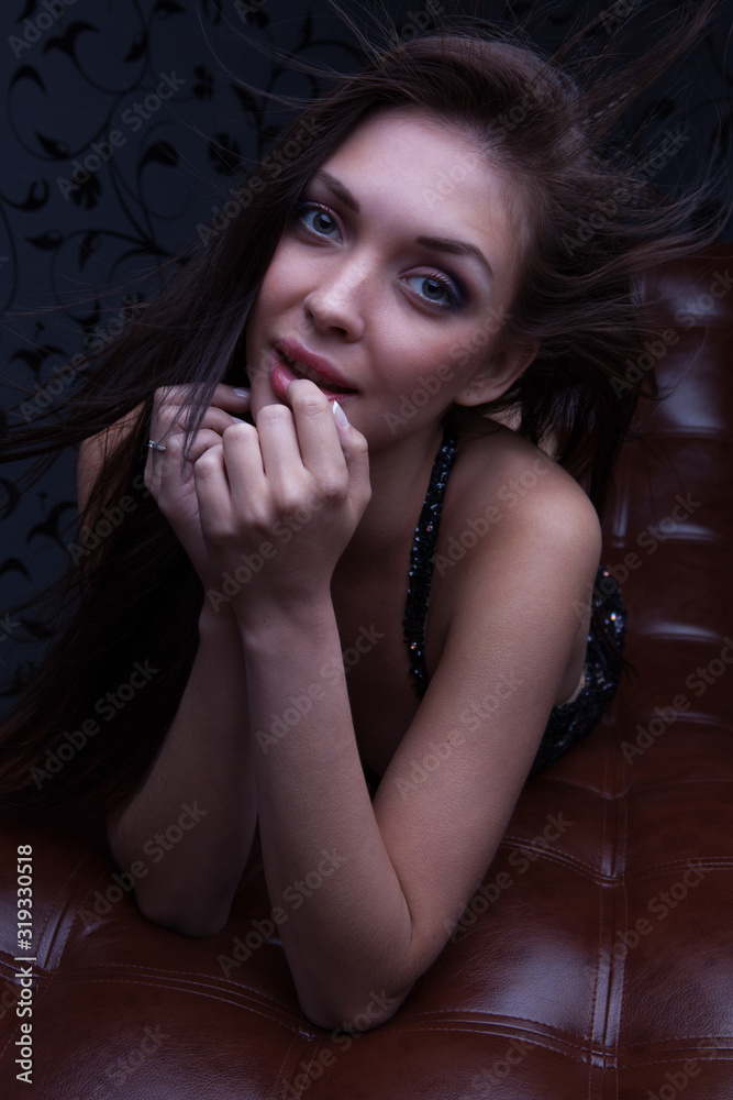 Young beautiful stylish girl in modern interior.