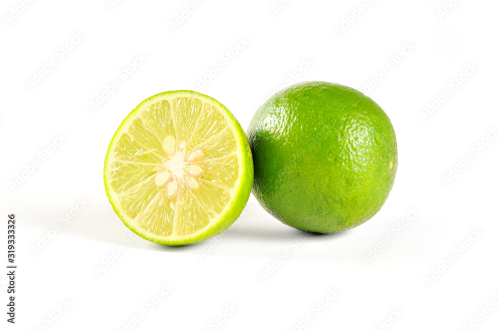 Sliced and whole fresh lime isolated on white background Sliced and whole fresh lime isolated on white background