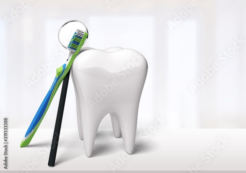 Bigtooth model and toothbrush on background photo