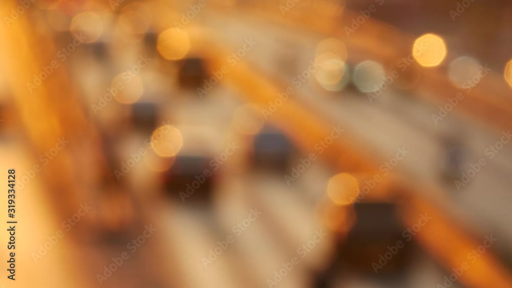 Blurred footage of many cars on the road are driven to workplace. Traffic on the road in the morning in Bangkok, Thailand.