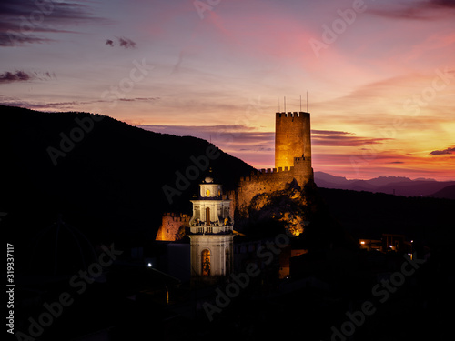 medieval castle tower and church dome at night