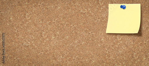 cork board with a colored blank note pinned on it