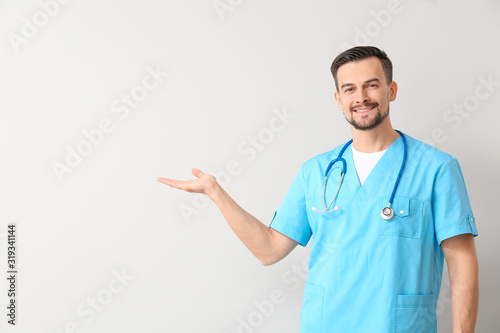 Portrait of male doctor sho...