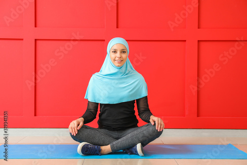 Sporty Muslim woman practic...