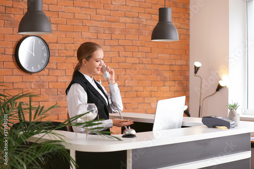 Young female receptionist t...