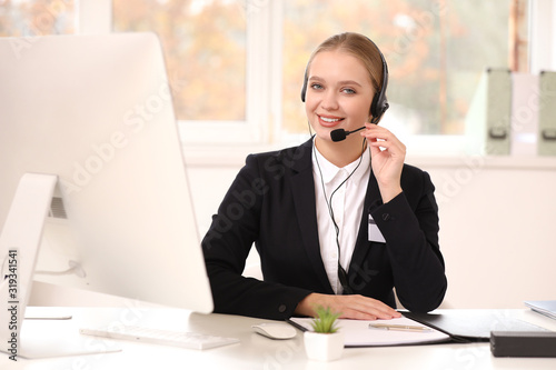 Female secretary working in...