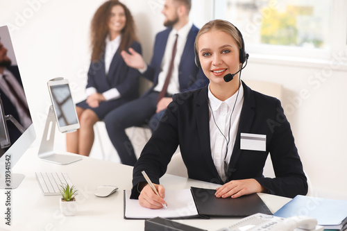 Female secretary working in...