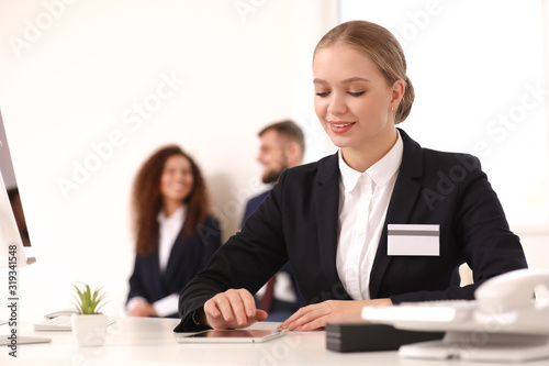 Female secretary working in...