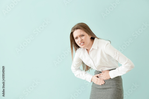 Young businesswoman sufferi...