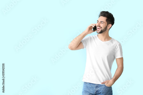 Happy young man talking by ...