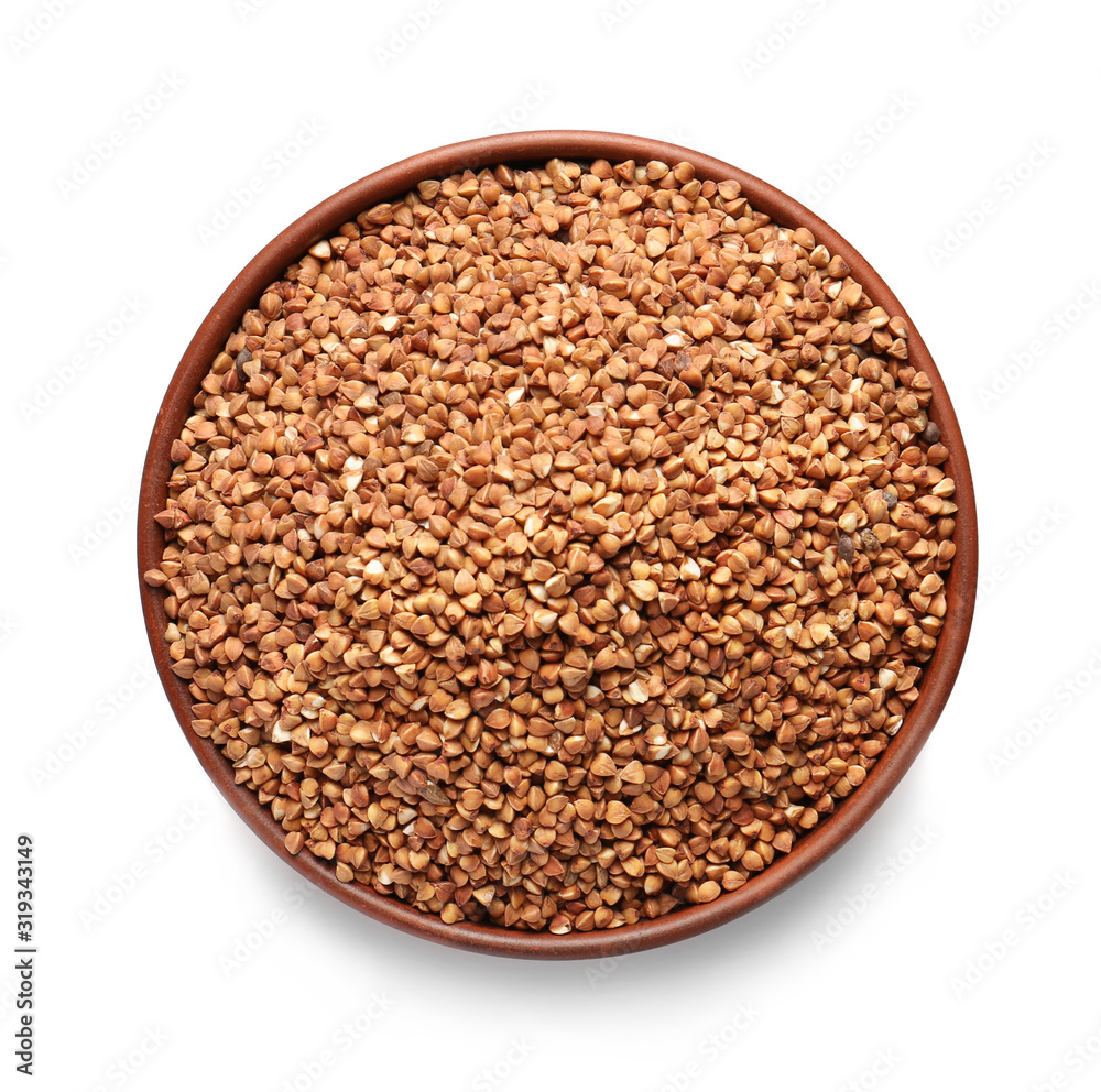 Bowl with raw buckwheat on white background Bowl with raw buckwheat on white background