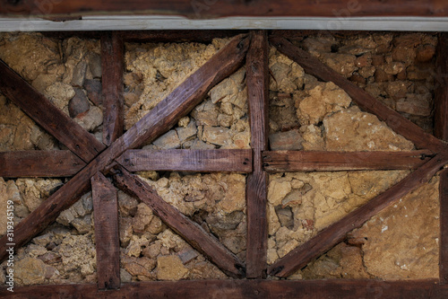 Old plastered wall with wooden beams. Old plastered wall with wooden beams
