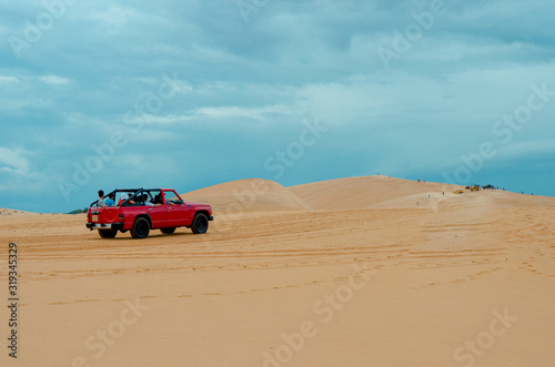 off road car vehicle in white sand dune desert at Mui Ne  Vietnam