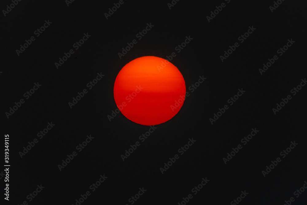 The sun turns red from the smoke haze generated by the Australian bush fires The sun turns red from the smoke haze generated by the Australian bush fires