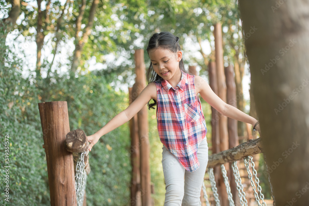happy little asian girl child having fun to playing in the playground in summer time with smile and laughing healthy, funny smiling face adorable lovely female kid. happy vacation lifestyle concept. happy little asian girl child having fun to playing in the playground in summer time with smile and laughing healthy, funny smiling face adorable lovely female kid. happy vacation lifestyle concept.