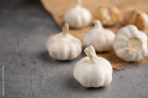 Garlic on the black table. High angle view