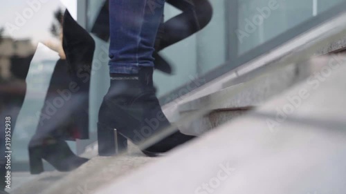 close-up of businesspeople walking up stairs outdoor