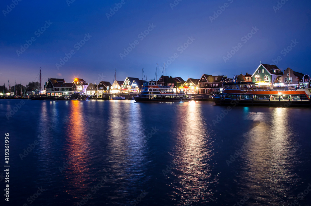 Dutch village at night, beautiful reflection in water, Volendam, Netherlands