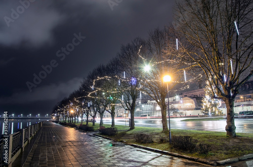 View of the riverbank with Christmas decoration, promenade in Riga, Latvia