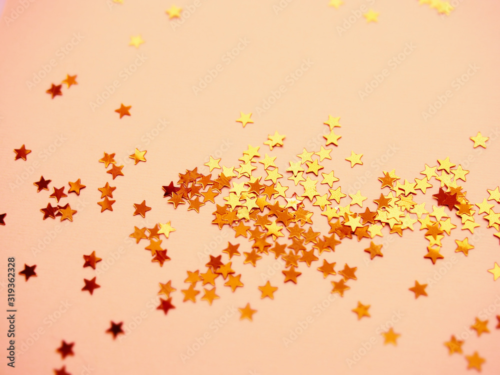 Golden stars glitter on pink background Golden stars glitter on pink background